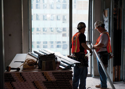 photo of 2 workers in a construction building project