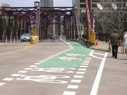 bike symbols on pavement at Kinzie bridge