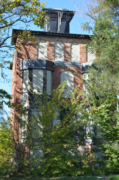 full frontal view of brick two story Italianate-style building in englewood