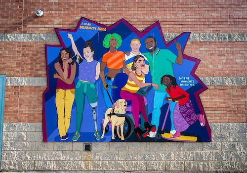 Central West Community Center mural of a diverse group of people with colorful clothes and various disabilities. Includes the text 